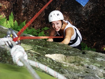 Picture of a female Camper Rock climbing