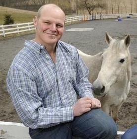 Director Jud pose for a picture with a horse