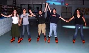 Five joyous Campers on skate getting ready for the evening activity.