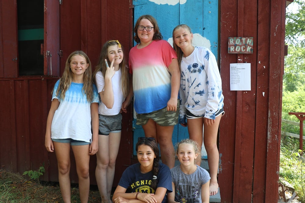 A group of Teen female Campers pose for a picture.