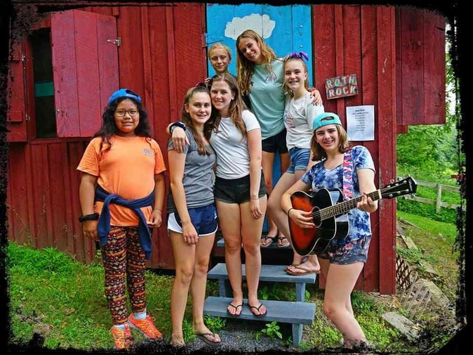 A group of female Teen Campers pose for a picture.