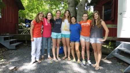 7 female Campers posing for a group picture.
