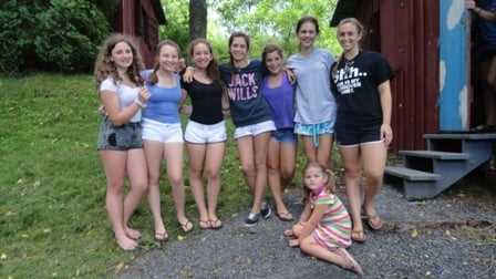 Female Campers posing for a group picture.