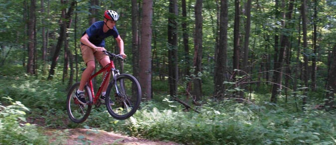 Picture of a male Camper Mountain Biking