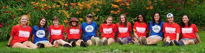 A group of Campers in SMA T shirt pose for a picture