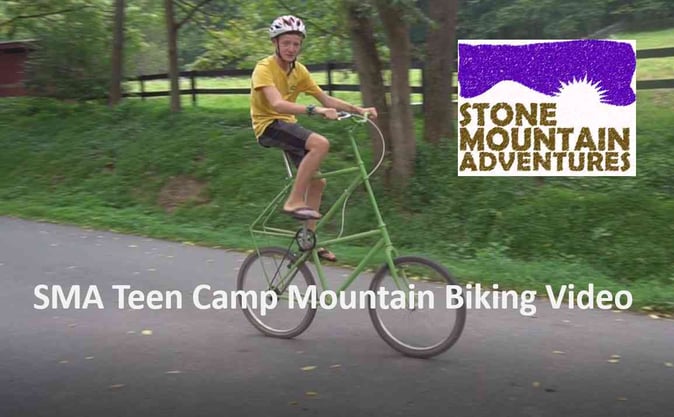 A screenshot from a video of a Camper riding bike