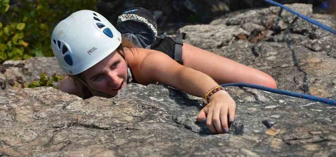Picture of a female Camper Rock Climbing