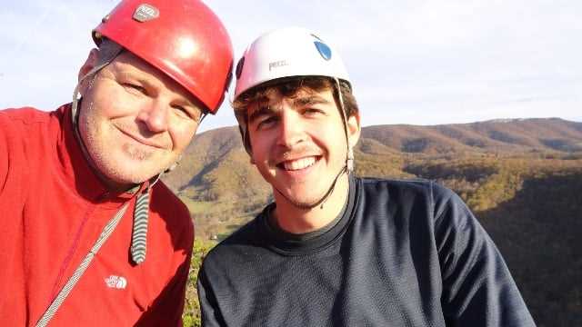 A picture of the camp director Jud, and a camper.