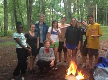 A group of Campers set up a fire camp.