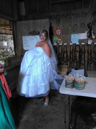 Jen poses for a picture in her wedding gown.