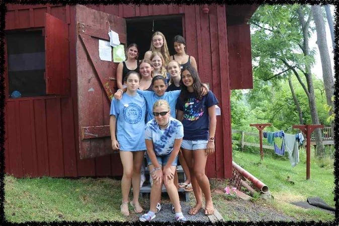 A group of Teen Campers pose for a group picture