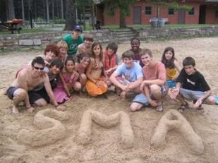A group of Campers posing with SMA molded with clay