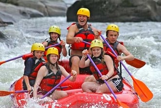 A picture of a group to teen Campers white water rafting.