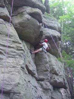 A Camper rock climbing