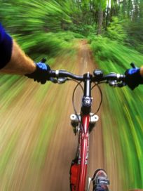 A Camper riding a bike.