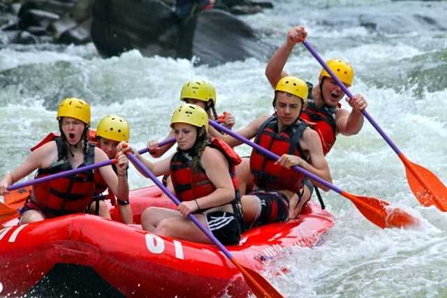 A group of Campers white water rafting.