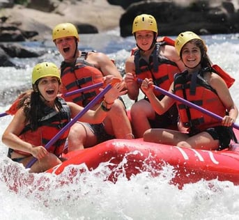 A group of Campers white water rafting.