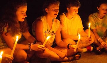 Pictures of some teen Campers participating in candle meeting.