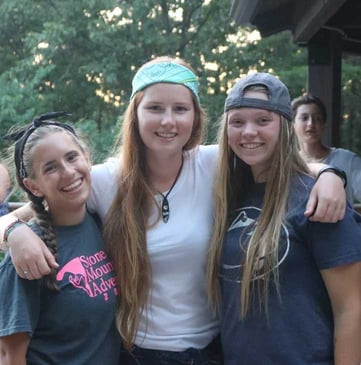 3 female Campers pose for a picture.