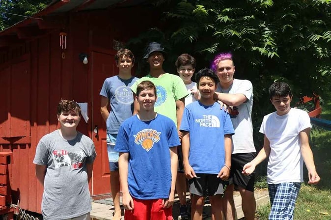 A group of male Teen Campers pose for a picture.