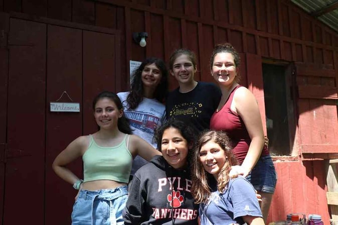 A group of Teen female Campers pose for a picture.