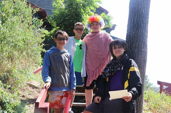A group of Teen male Campers pose for a picture.