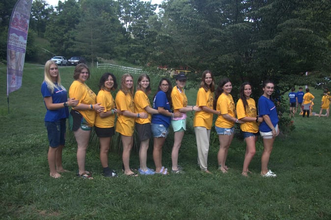 A group of Teen female Campers lined up for a picture.