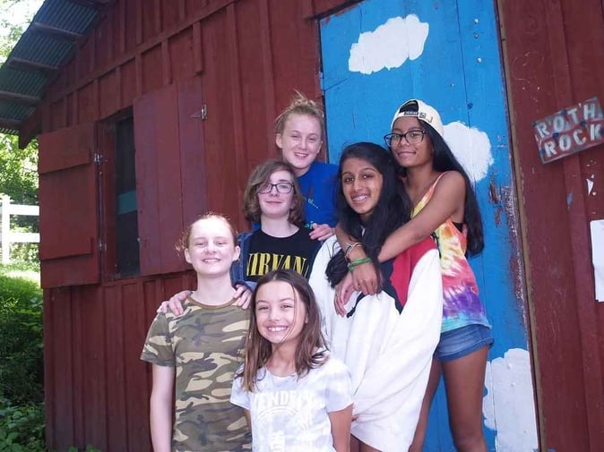 A group of Teen female Campers pose for a picture.