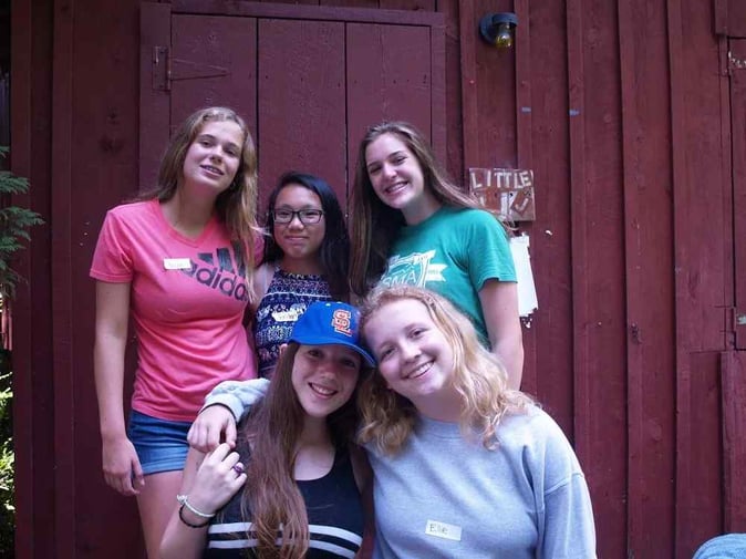 A group of Teen female Campers pose for a picture.