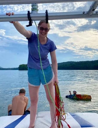 A female Camper pose for a picture on a ship