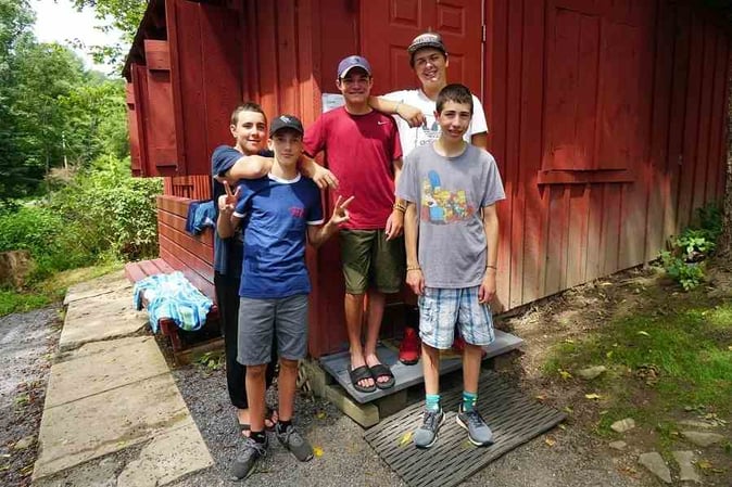 A group of Teen male Campers pose for a picture