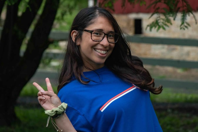 A female staff pose for a picture