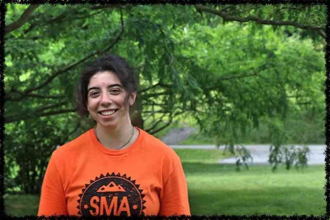 A female SMA staff pose for a picture.
