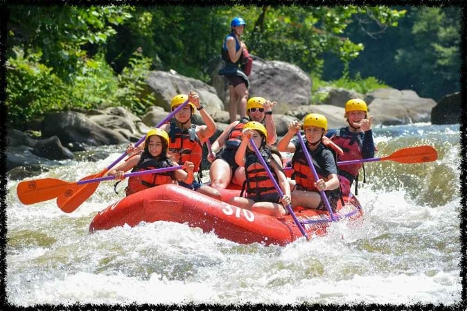 A group of Campers white water rafting