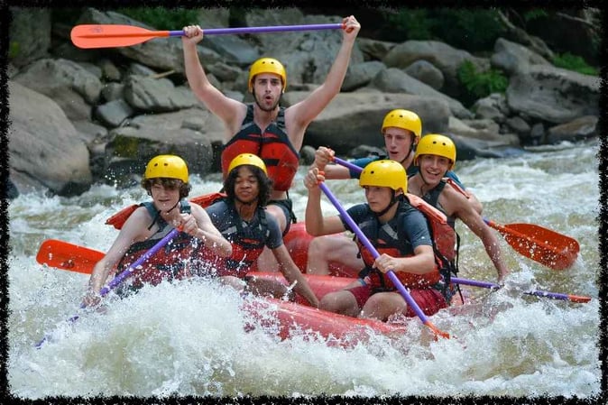 A group of Campers white water rafting