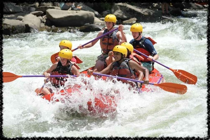 A group of  Campers white water rafting
