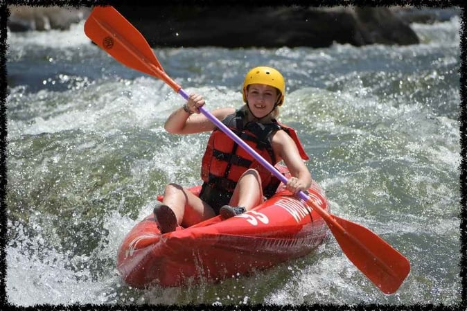 Picture of a Camper whiter water rafting