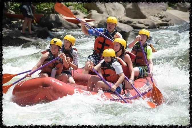 A group of Campers white water rafting
