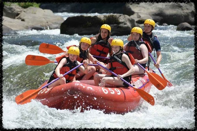 A group of Campers white water rafting