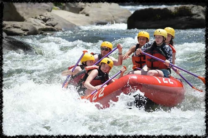 A group of Campers white water rafting