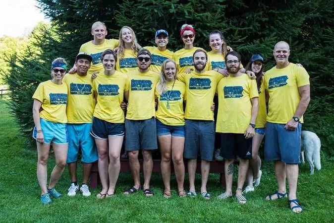 Picture of the camp director and some Campers in SMA T-shirt