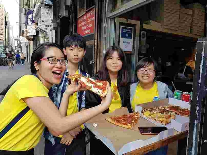 Picture of international Campers having Pizza