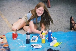 Picture of a female Camper setting the stage for her creative art exhibition