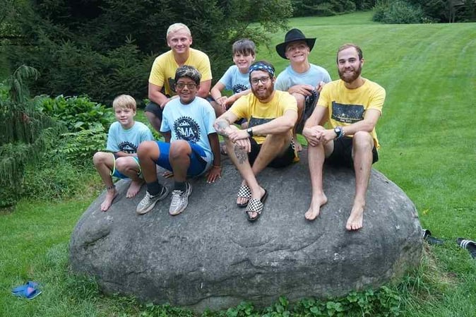 A group of male Campers pose for  a  picture