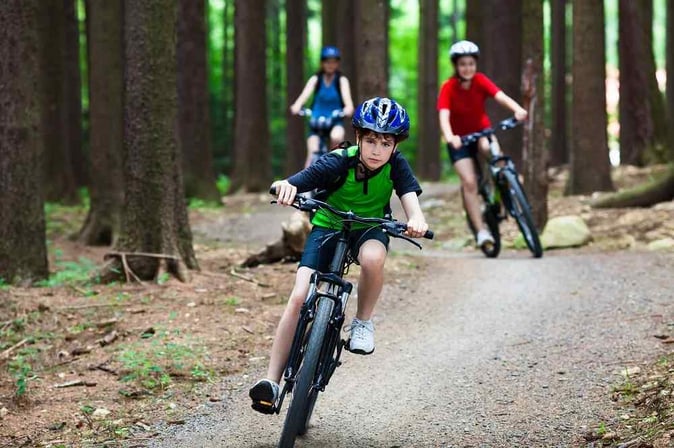 Photo of Teen Campers riding bike