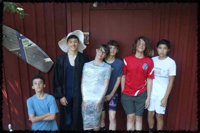 A group of Teen male campers pose for a picture