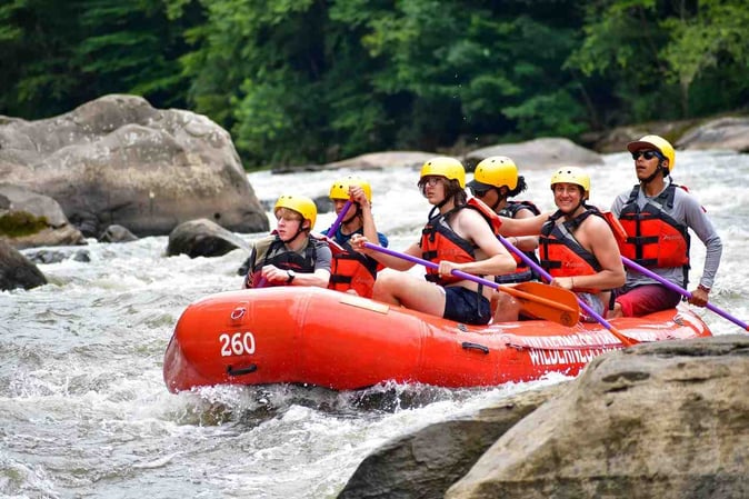 A group of Campers white water rafting