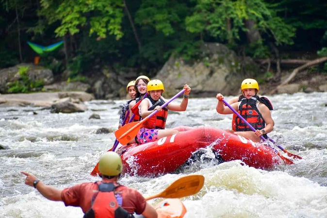 A group of Campers white water rafting