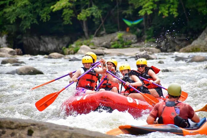 A group of Campers white water rafting