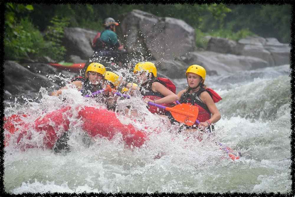 A group of Campers White Water Rafting 